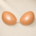 The Push-Up Bra, a nude silicone adhesive push-up bra with a reinforced front clip