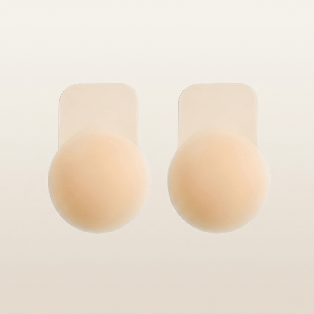 The Lift Nipple Cover, a nude silicone petal nipple cover with a lift tab