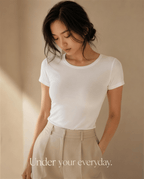 Lune Daily Bra everyday lifestyle shot — invisible adhesive bra under white tee